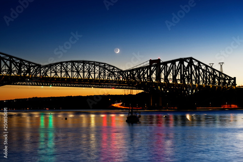 The Pont du Quebec and the St Lawrence River at dusk as seen from Parc de la Marina-de-la-Chaudière, St-Romuald