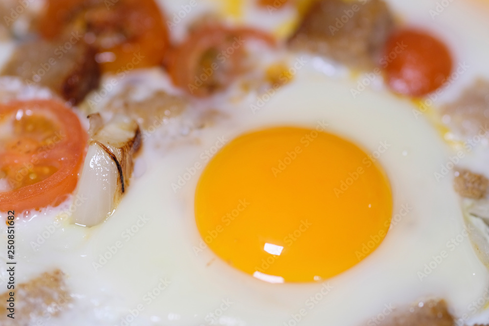 The image of fried eggs close up The image of fried eggs close up