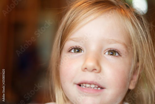 A portrait of a beautiful smiling four year old girl