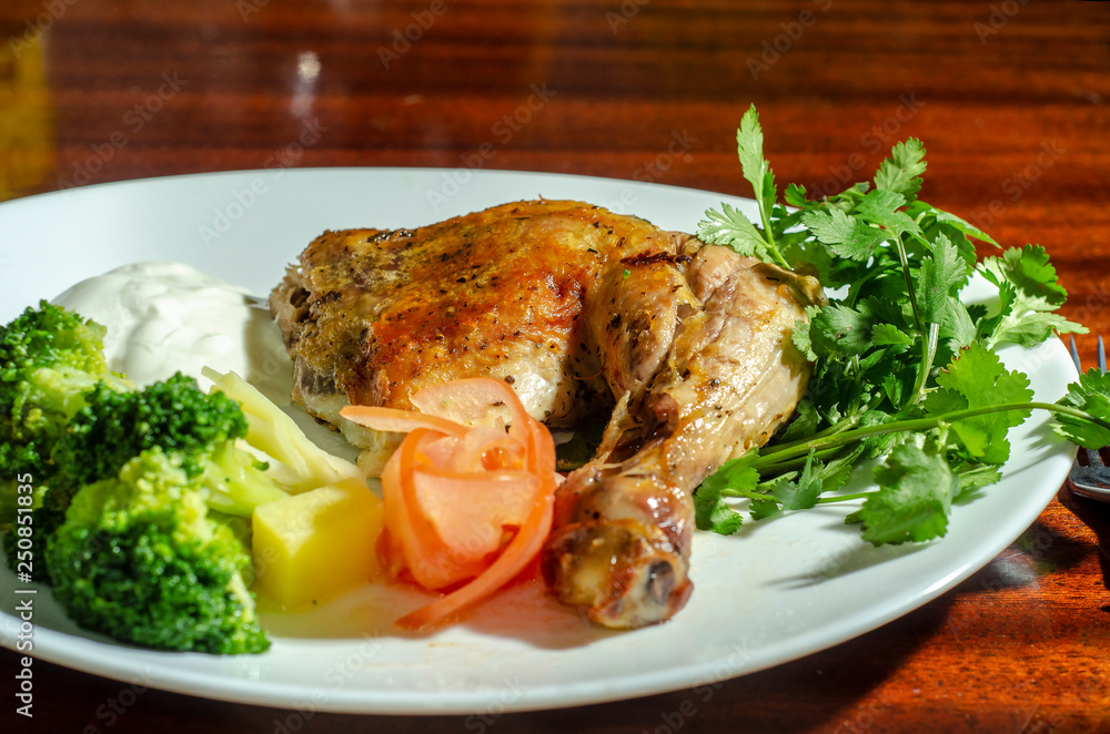 traditional fried chicken with vegetables sauce and greens traditional fried chicken with vegetables sauce and greens