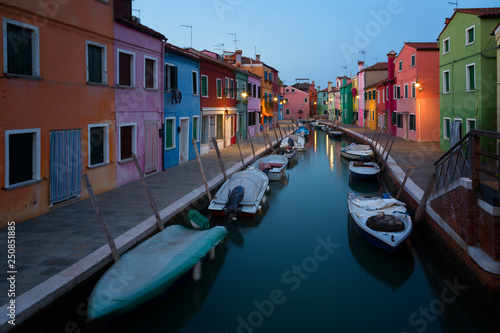 Old colorful houses and boats at night in Burano  Venice Italy.