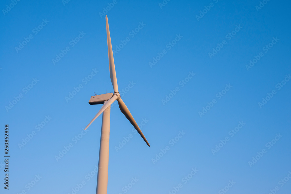 wind turbine with blue sky and copy space wind turbine with blue sky and copy space