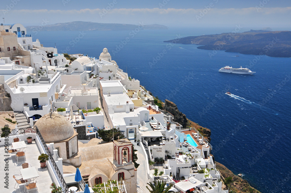 Afternoon view over town and ocean at Fira Thira Santorini Island Greece.