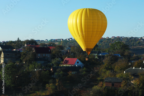 Beautiful view of hot air balloon flying over countryside