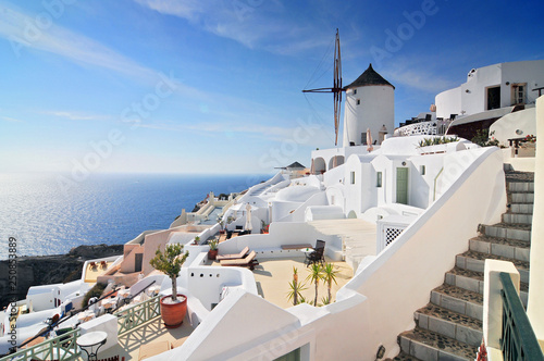 Santorini landscape with white houses and windmill, Oia Town, Santorini Island, Cyclades, Greece.