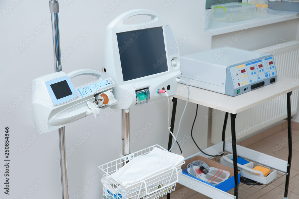 Syringe dispenser system in modern clinic. Surgery equipment Syringe dispenser system in modern clinic. Surgery equipment