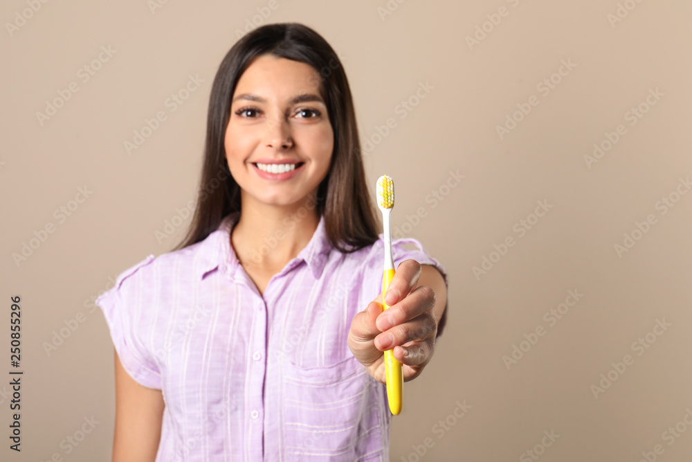 Young woman with toothbrush on color background, space for text. Teeth care Young woman with toothbrush on color background, space for text. Teeth care