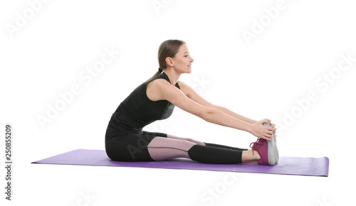 Young woman doing sports exercises isolated on white. Home fitness