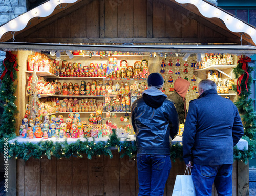 Photography Two men looking at Russian Dolls in the Toronto Christmas Market in the Distille