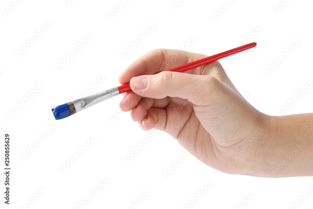Young woman holding brush with color paint on white background, closeup Young woman holding brush with color paint on white background, closeup