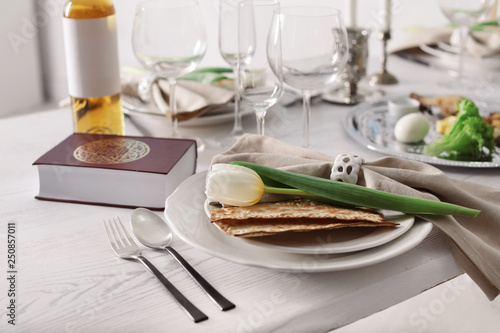 Festive Passover table setting with Torah. Pesach celebration