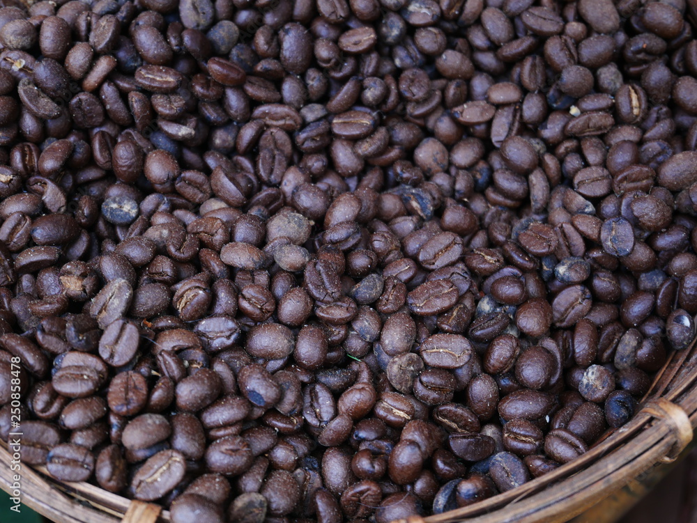 coffee beans and cinnamon sticks on wooden background coffee beans and cinnamon sticks on wooden background