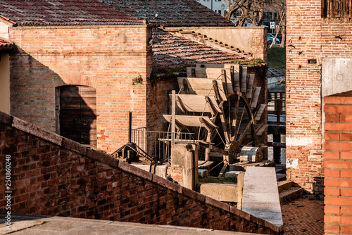 Old brick mill along a river
