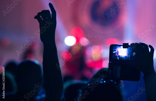 People at concert shooting video or photo