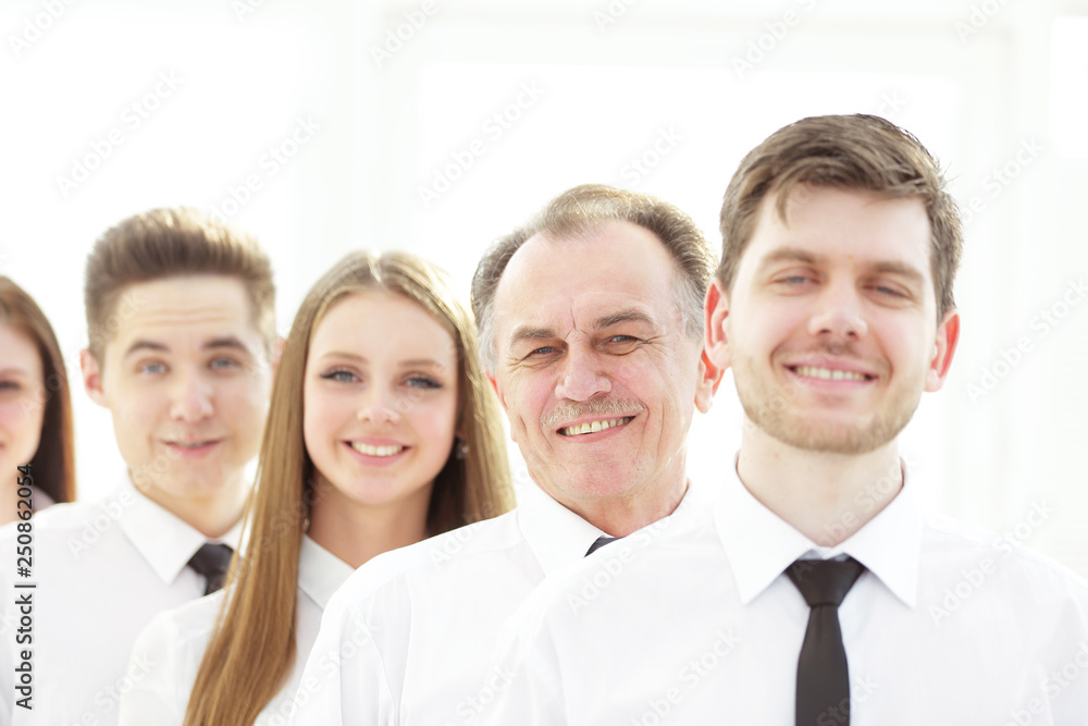close up. a successful group of employees standing in a row close up. a successful group of employees standing in a row