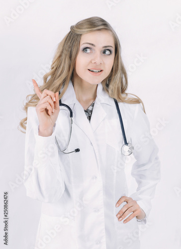 female doctor pointing at copy space .isolated on white
