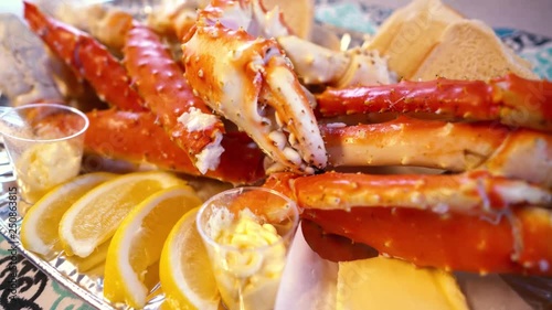 Red king crab legs with fresh lemon slices photo