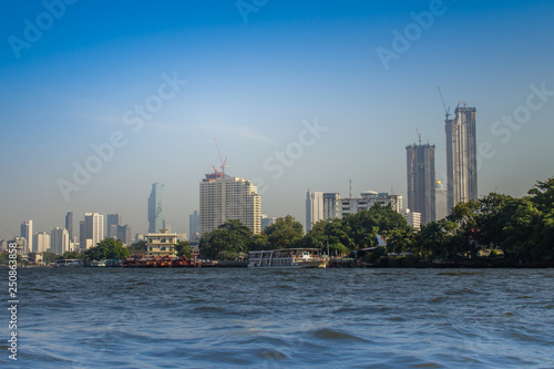 Beautiful Bangkok cityscape view from Chao Phraya River. Bangkok is the capital and most populous city of the Kingdom of Thailand  the world s top tourist destinations.