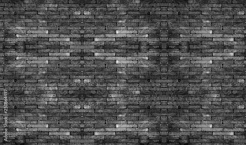 Black brick wall. The texture black stone blocks. Abstract background for design.