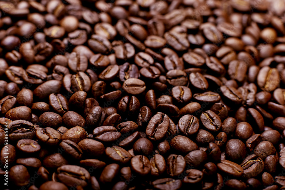 Aroma roasted coffee beans, brown banner background. Soft focus close up. Aroma roasted coffee beans, brown banner background. Soft focus close up.