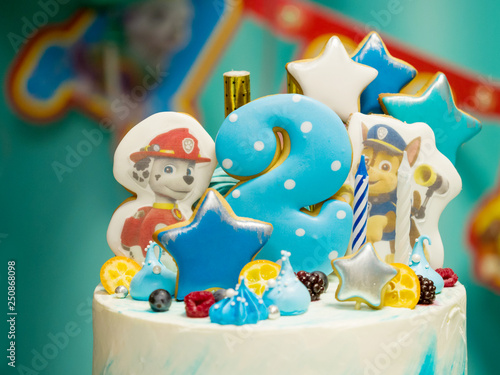 Children's beautiful cake for a boy on his birthday with the number two