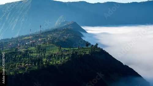 4K Cinematic Zooming Out Timelapse Footage of The Dancing Carpet Clouds of Bromo Tengger Semeru National Park at Cemoro Lawang vilage, Ngadisari, East Java, Indonesia.