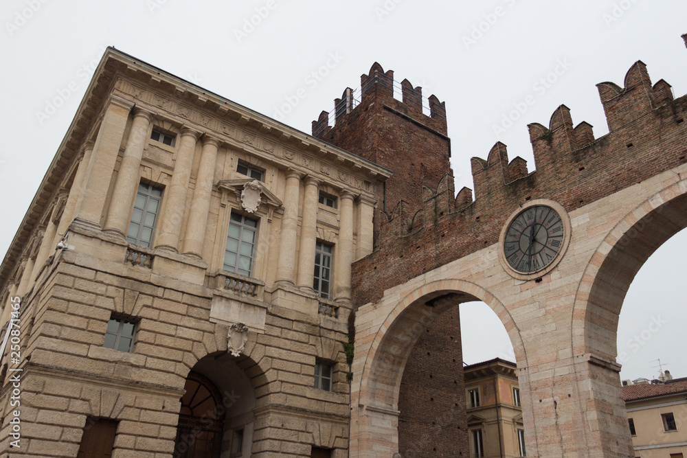 Corso Porta Nuova street and medieval Gates Portoni della Bra, Verona, Italy.