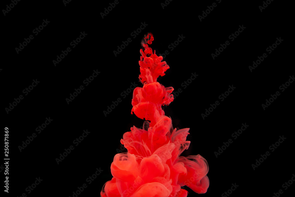 Ink in water. Abstract background. . Ink swirling in water. Ink in water isolated on black background. Colorful ink in water.