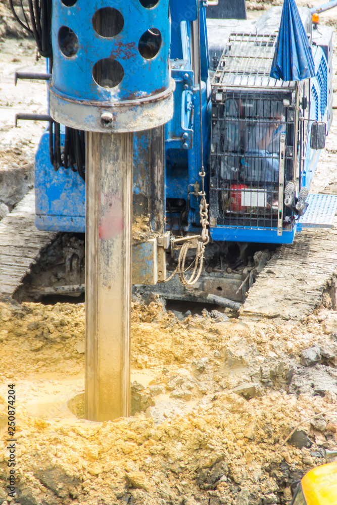 Hydraulic drilling machine is boring holes in the construction site for