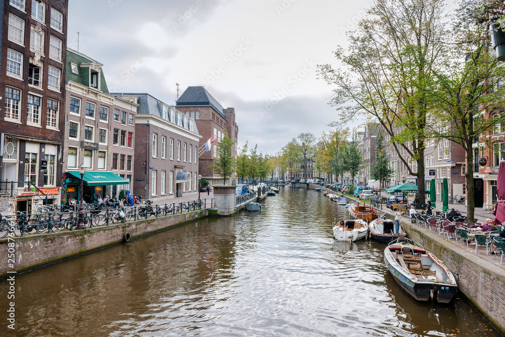 Amsterdam, Netherlands - September 27, 2011: One of the many bridges across Amsterdam canals. Amsterdam has more than 100 kilometres of canals, about 90 islands and 1,500 bridges.