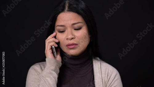 Angry woman screams at phone and tries to calm down