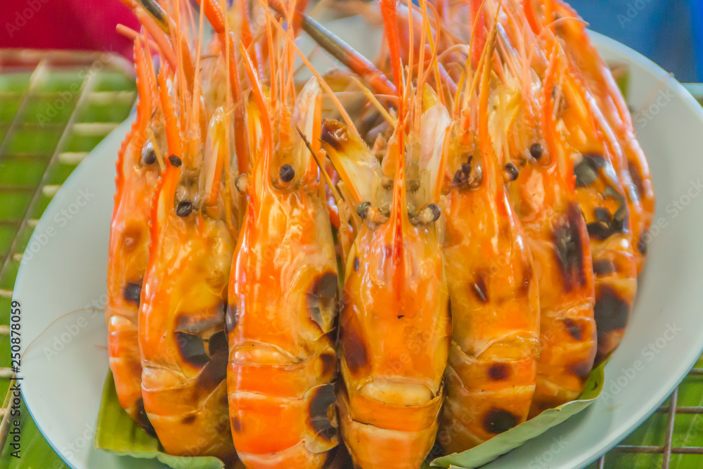Grilled shrimps for sale in the street seafood market, Bangkok, Thailand.