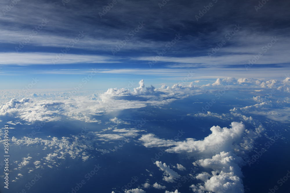 Fototapeta premium cloud with blue sky taken from airplane, dramatic clouds
