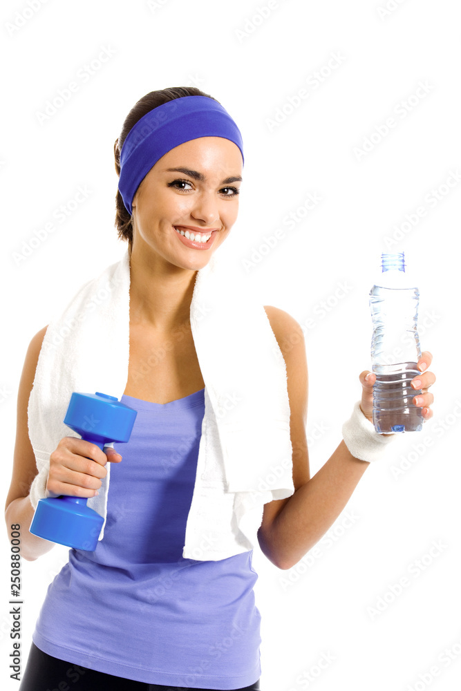 Happy smiling woman in violet sportswear with bottle of water and dumbbell Happy smiling woman in violet sportswear with bottle of water and dumbbell