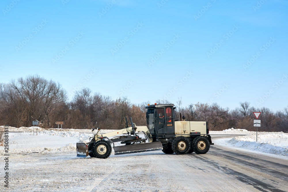 The snowplow clearing the snow off the roads