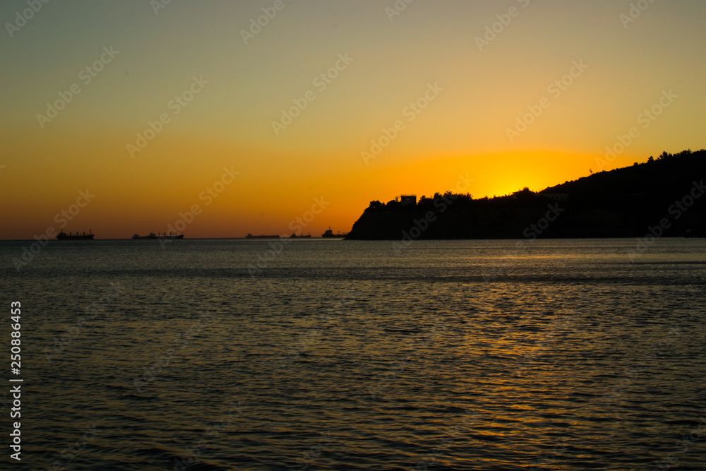 Naklejka premium sunset on the Black sea on a warm July evening