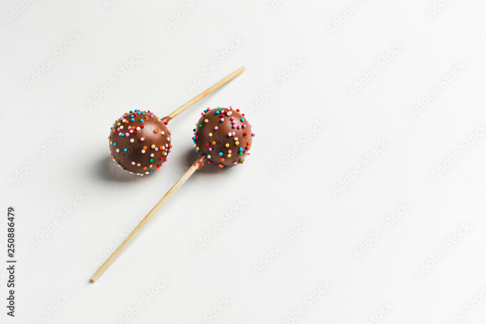 cake pops on wooden stand on white background cake pops on wooden stand on white background