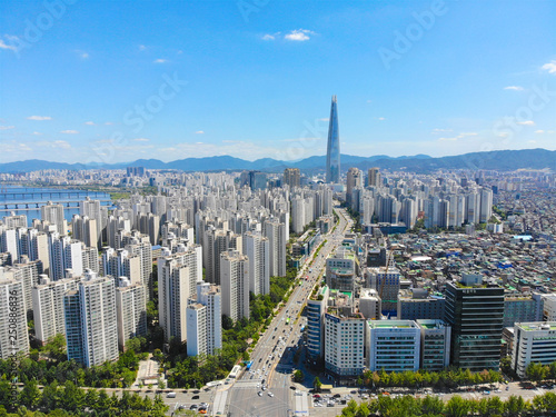 Aerial view cityscape of Seoul, South Korea. Aerial View Lotte tower at Jamsil. View of Seoul with river and mountain. Seoul downtown city skyline, Aerial view of Seoul, South Korea, 08/20.2018