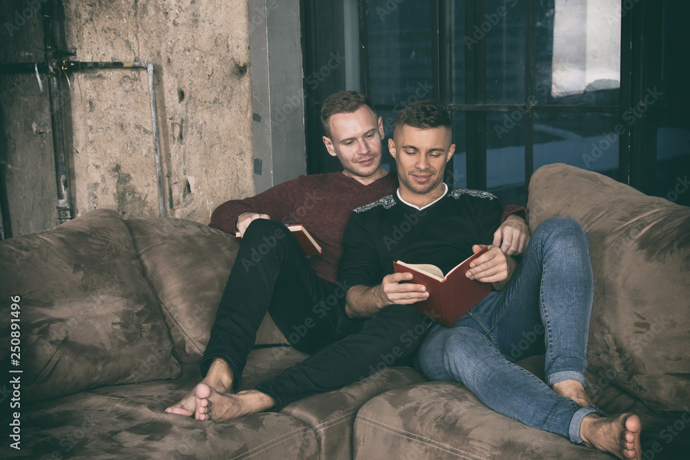 Friends at home reading books. Friends at home reading books.