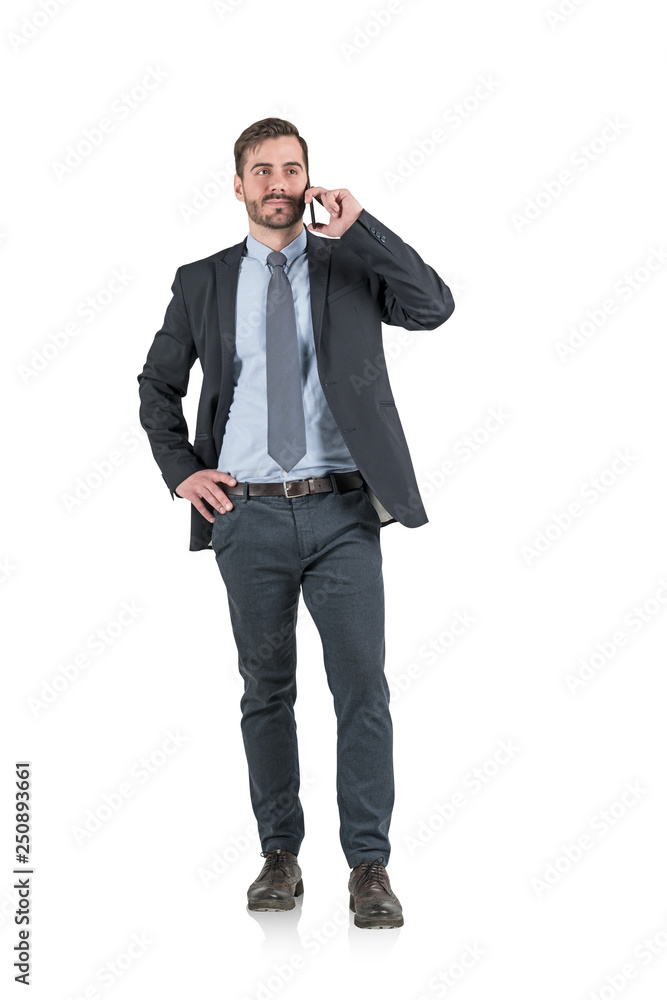 Calm businessman talking on smartphone, isolated Calm businessman talking on smartphone, isolated