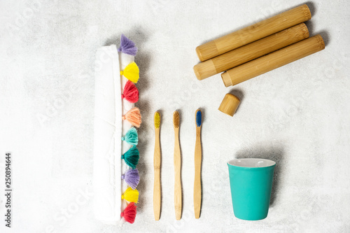 A family set of wooden bamboo toothbrushes on white background