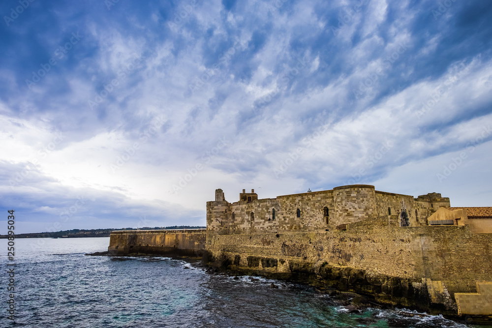 Middle Aged Maniace Castle on seacoast in island of Ortigia on Sicily, Siracusa