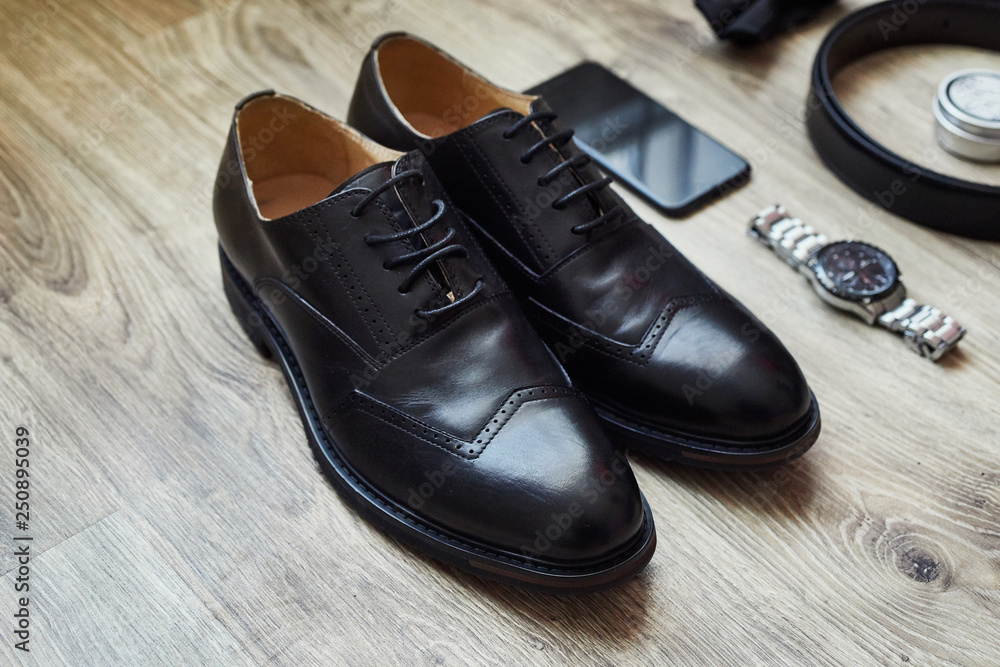 different accessories of a businessman for creating a style of a people lie on a wooden background different accessories of a businessman for creating a style of a people lie on a wooden background