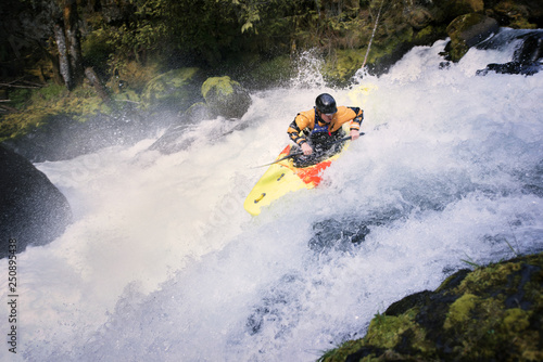 Young man canoeing  photo