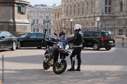 Photography Police motorcycle on the street and government column behind