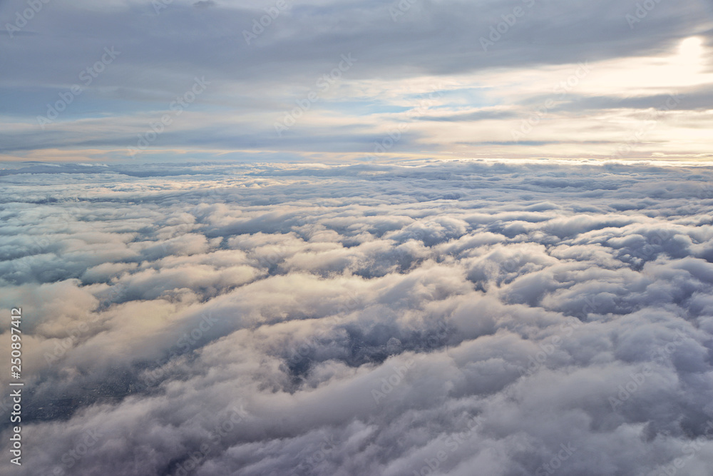Above the clouds, airplane view Above the clouds, airplane view
