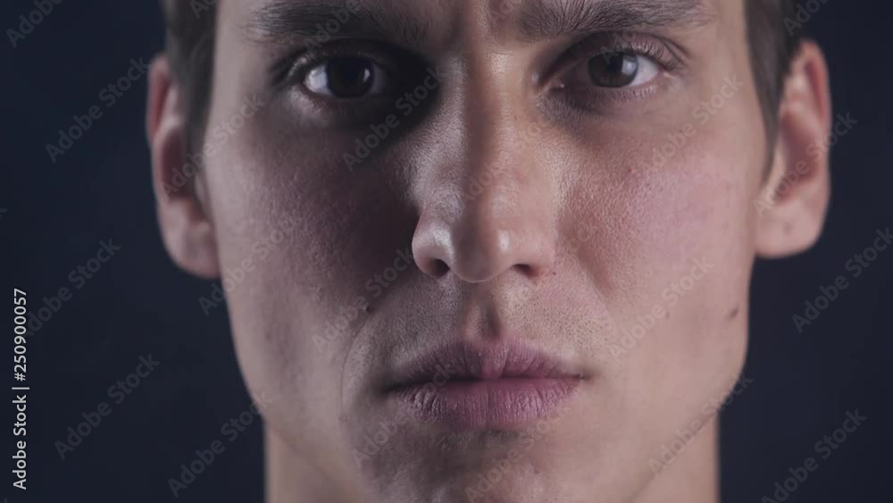 Focused glance. Male looks at camera isolate. Man looks handsome and cool. Guy concentrated focused looking forward. Closeup Focused glance. Male looks at camera isolate. Man looks handsome and cool. Guy concentrated focused looking forward. Closeup