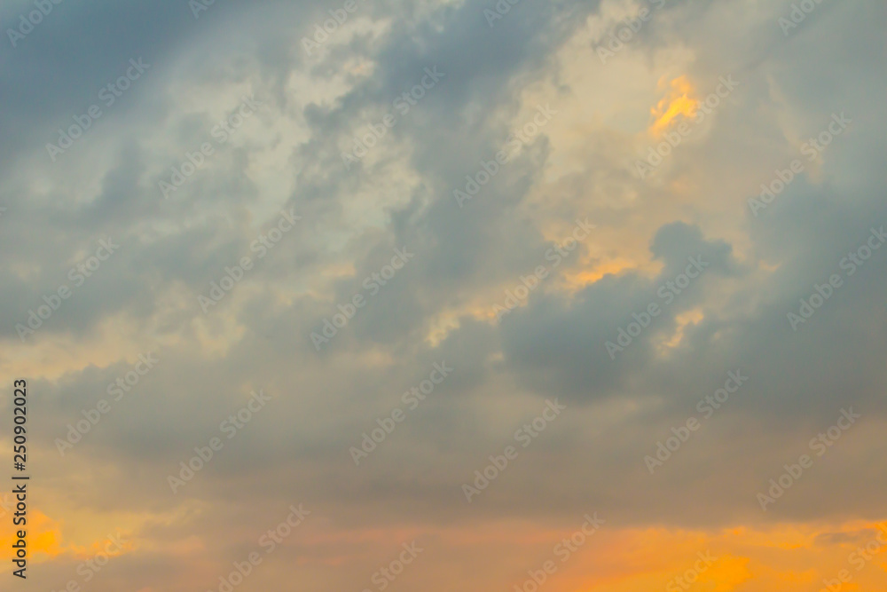 Beautiful dramatic red clouds with blue sky during sunset. Twilight sunset with blue sky and orange clouds background.