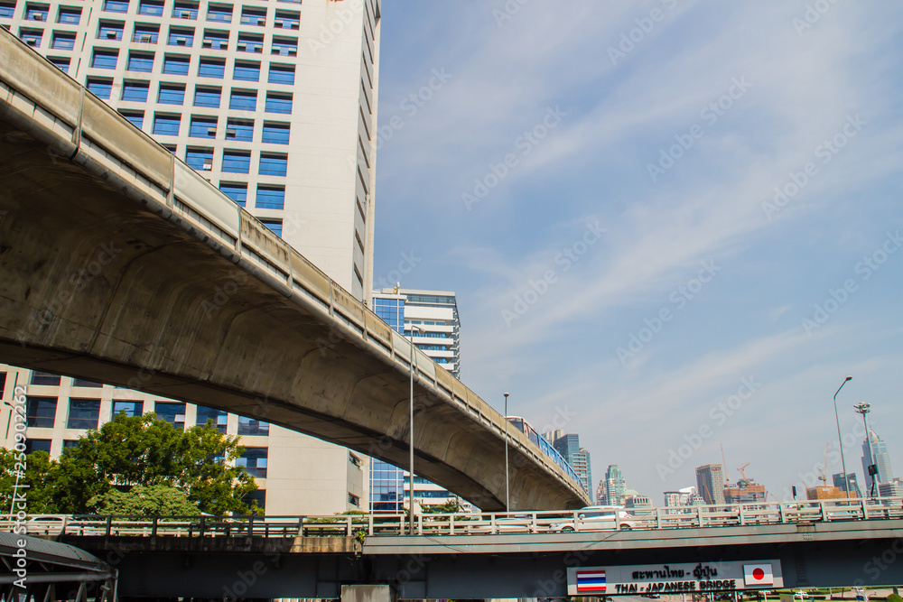 Sky train bridge structure with beam and girder under blue sky background. Railway and tollway in the city with blue sky background. Public area in Bangkok, Thailand. Sky train bridge structure with beam and girder under blue sky background. Railway and tollway in the city with blue sky background. Public area in Bangkok, Thailand.