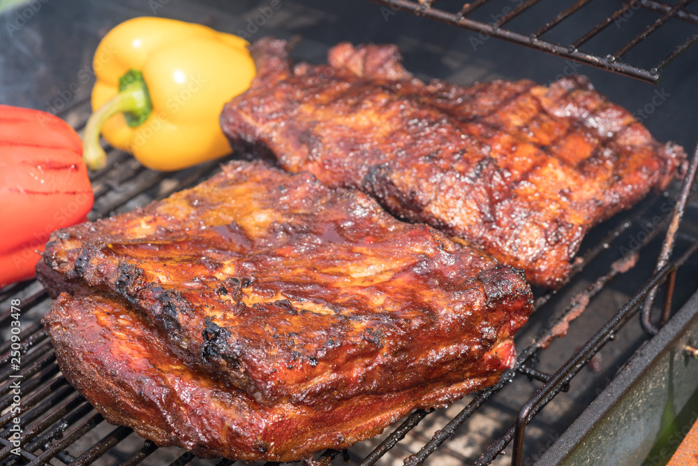 Grilled pork ribs on the grill. Summer outdoor